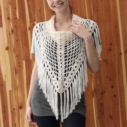May include: A white crocheted shawl with a fringe border. The shawl is triangular in shape and has a delicate openwork pattern.