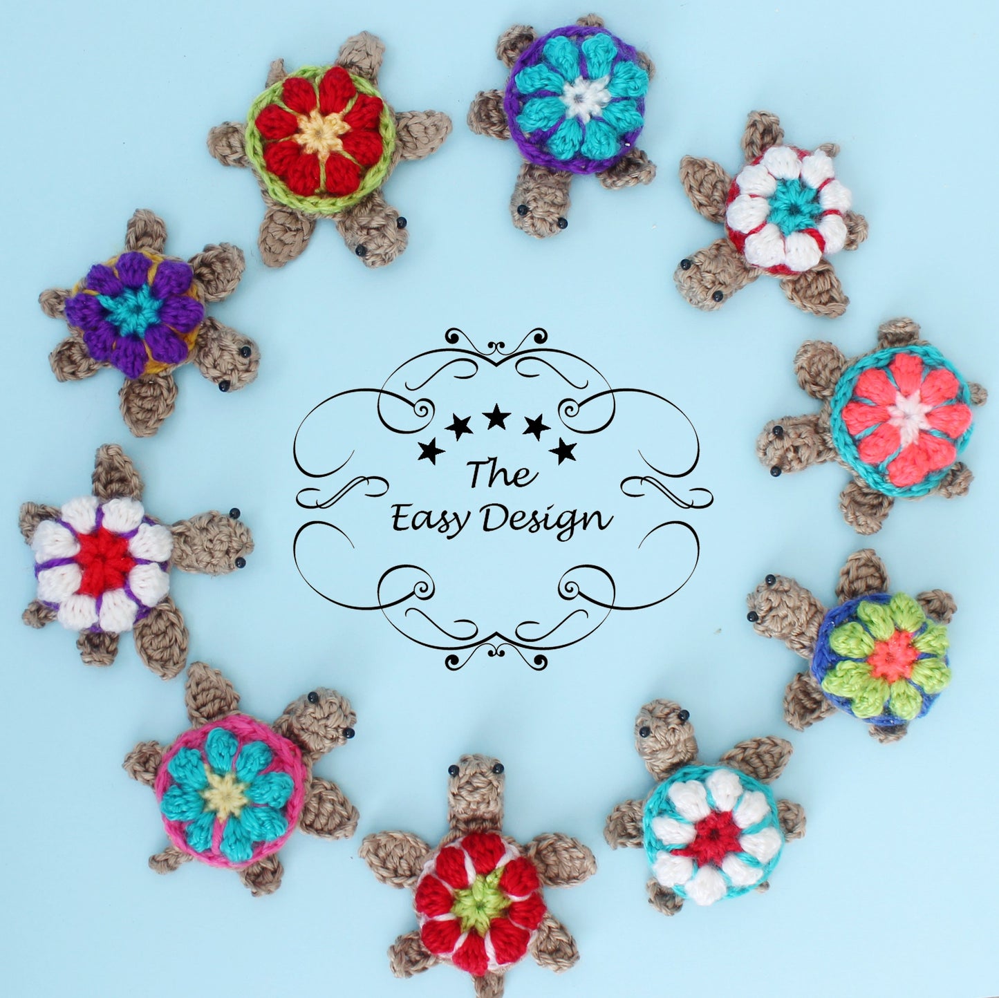 May include: A circle of ten crocheted turtle ornaments with colorful flower designs. The turtles are arranged in a circle around a sign that reads "The Easy Design".