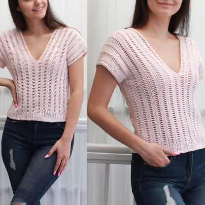 May include: A pink crochet top with a V-neck and short sleeves. The top is made with a delicate open stitch pattern.