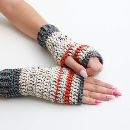 May include: A pair of fingerless gloves with a white, gray, and orange striped pattern. The gloves are crocheted and have a textured look.