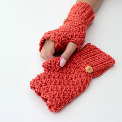 May include: A pair of coral-colored crocheted fingerless gloves with wooden buttons. The gloves are made with a textured stitch and have a fold-over cuff.