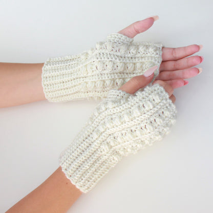 May include: A pair of white crocheted fingerless gloves with a textured design.