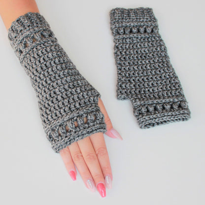 May include: A pair of gray fingerless gloves with a crocheted design. The gloves have a decorative openwork pattern on the back of the hand.