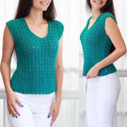 May include: A teal crochet top with a delicate openwork pattern. The top has a v-neck and short sleeves. The model is wearing white pants.