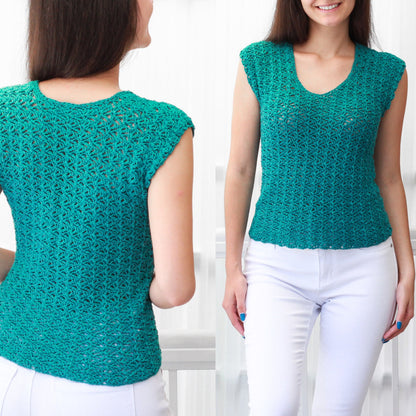 May include: A teal crochet top with a scoop neck and short sleeves. The top is made with a delicate open stitch pattern.