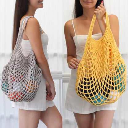 May include: Two women are holding crocheted tote bags. One bag is gray with orange, red, and white accents. The other bag is yellow with blue and green accents.