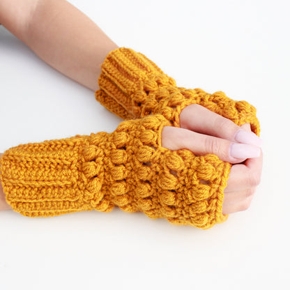May include: A pair of yellow crocheted fingerless gloves with a textured design.