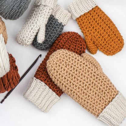 May include: Five crocheted mittens in various colors, including beige, brown, and orange. The mittens are made with a textured stitch and have a white cuff.