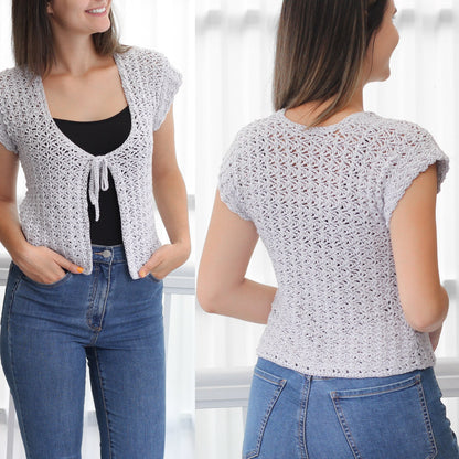 May include: A light gray crochet cardigan with a tie front and short sleeves. The cardigan is open in the front and has a delicate, lacy pattern.
