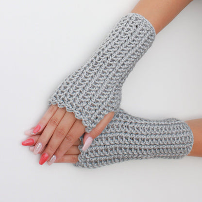May include: A pair of gray fingerless gloves made of crocheted yarn. The gloves are shown on a white background.