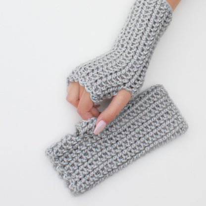 May include: A pair of gray fingerless gloves made of crocheted yarn. The gloves are laid flat on a white surface.