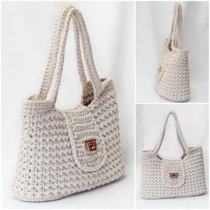 May include: A cream-colored crocheted tote bag with a gold clasp. The bag has a wide, open top and two long handles.