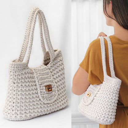 May include: A white crocheted tote bag with a gold clasp. The bag has a textured, woven design and is shown on a white background.