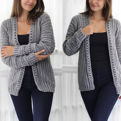 May include: A gray crocheted cardigan with a long open front and long sleeves. The cardigan is shown being worn by a person.