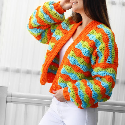 May include: A bright orange, green, and blue striped crocheted cardigan with long sleeves and a button closure.
