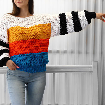 May include: A colorful striped crochet sweater with long sleeves and a relaxed fit. The sweater features a white base with horizontal stripes of yellow, orange, and blue.