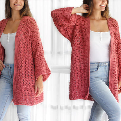 May include: A long, open-front cardigan in a dusty rose color, crocheted with a lacy stitch pattern. The cardigan has wide, flowing sleeves and a relaxed fit.