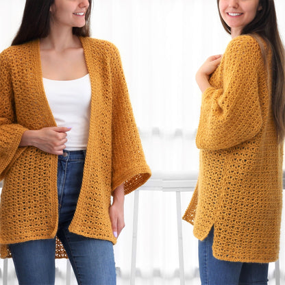 May include: A mustard yellow crochet cardigan with a loose fit and long sleeves. The cardigan is open in the front and has a delicate stitch pattern.
