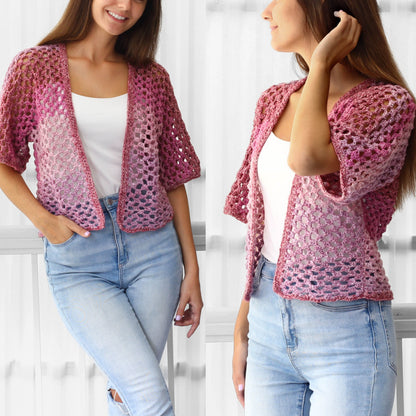 May include: A pink and white crochet cardigan with a loose fit and short sleeves. The cardigan is made with a delicate open stitch pattern.