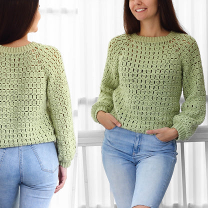 May include: A light green crochet sweater with a loose fit and long sleeves. The sweater has a round neckline and a simple stitch pattern.