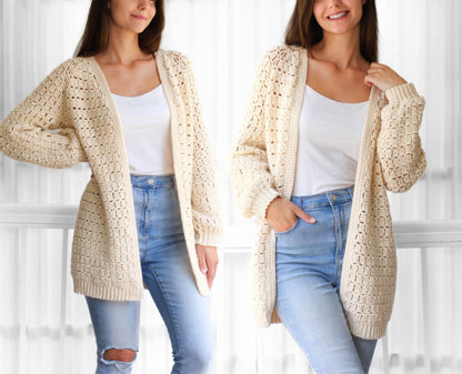 May include: A cream-colored crochet cardigan with a loose fit and open front. The cardigan has a delicate stitch pattern and is shown being worn with a white tank top and blue jeans.