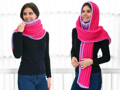 May include: Two women wearing a pink and purple crocheted scarf. The scarf can be worn as a cowl or a hood.