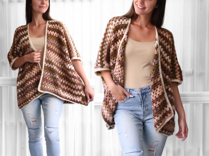 May include: A brown, pink, and white crochet cardigan with a diagonal stripe pattern. The cardigan has a loose fit and short sleeves.