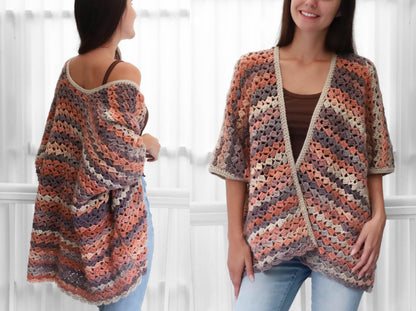 May include: A multi-colored crochet cardigan in shades of peach, gray, and cream. The open-front design features short sleeves and a contrasting trim. The garment is shown on a person wearing a brown top and blue jeans.